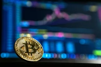 gold-colored Bitcoin by André François McKenzie courtesy of Unsplash.